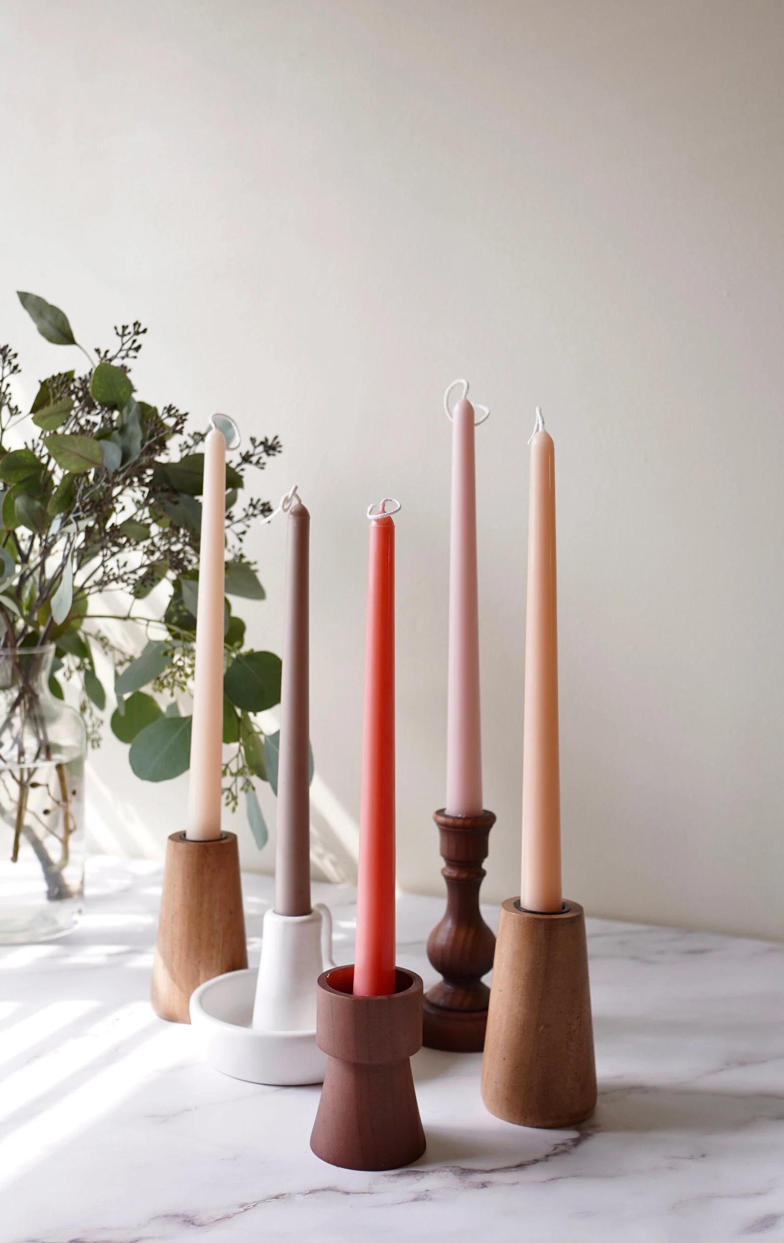 taper candles in wood candle sticks