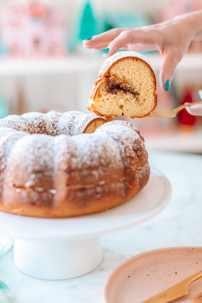 Slice of coffee cake being lifted out of bundt cake
