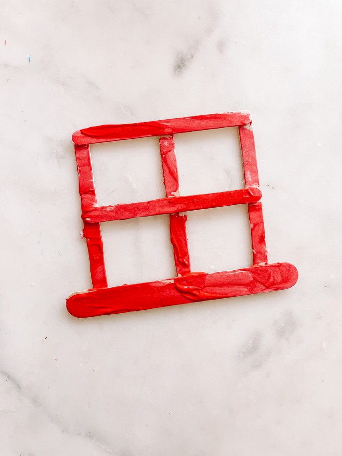 Red painted popsicle stick window