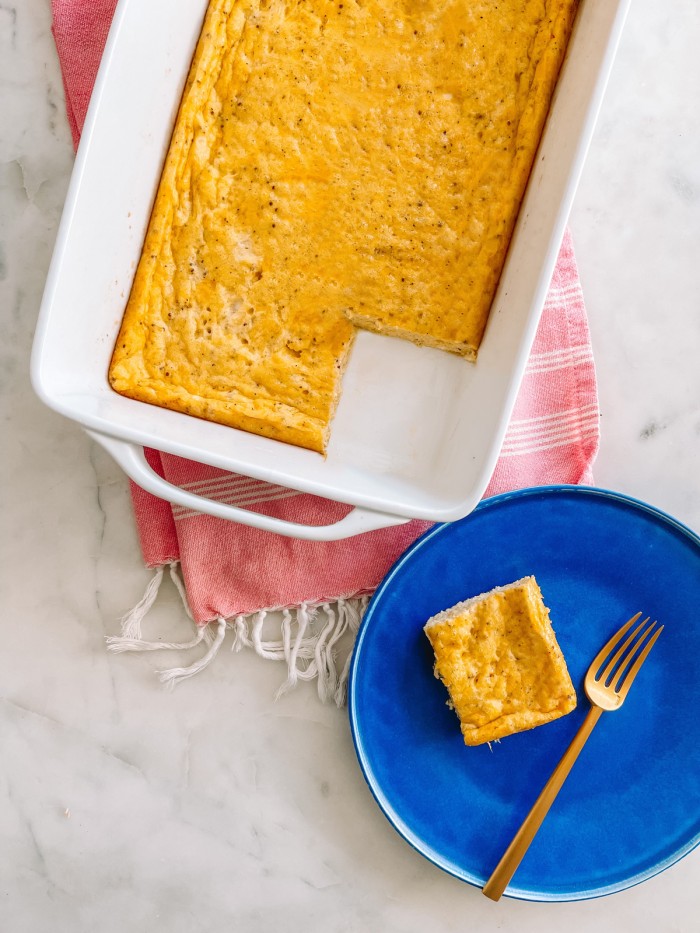 Cheddar egg Bake on table with plate