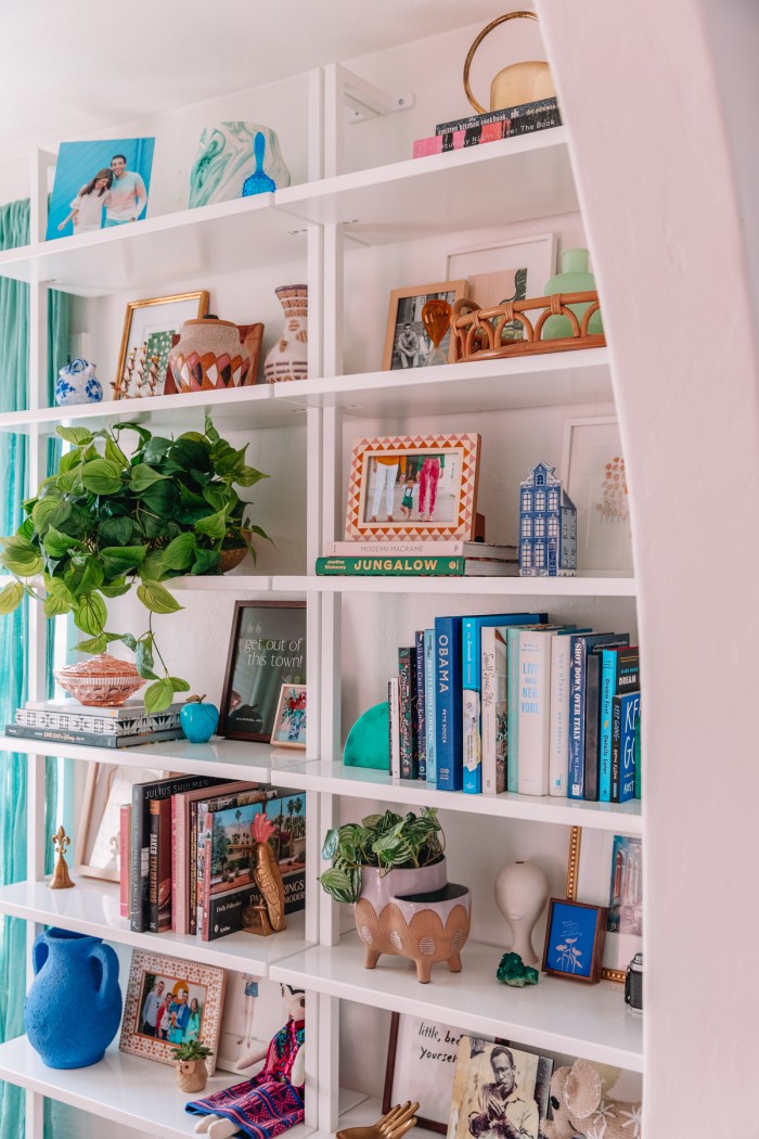White bookshelves with decor and books