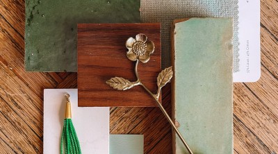 Green bathroom swatches on wood table