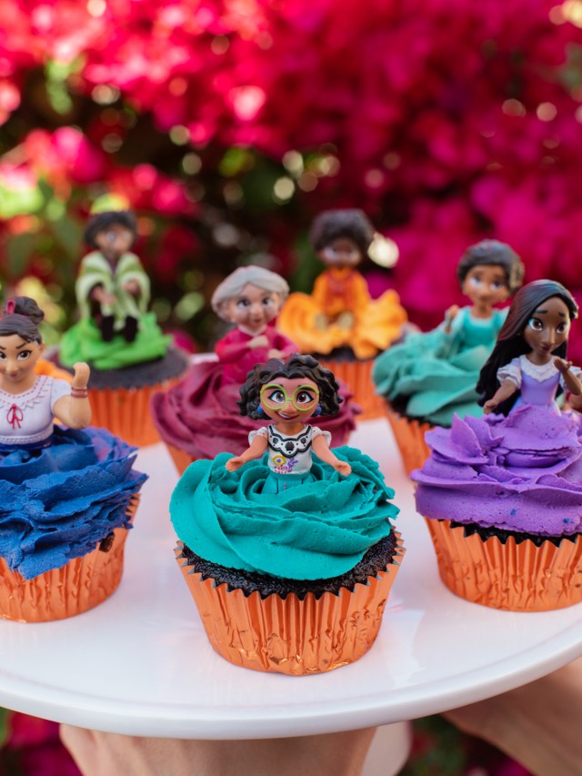 Cupcakes with different Encanto characters on top. 