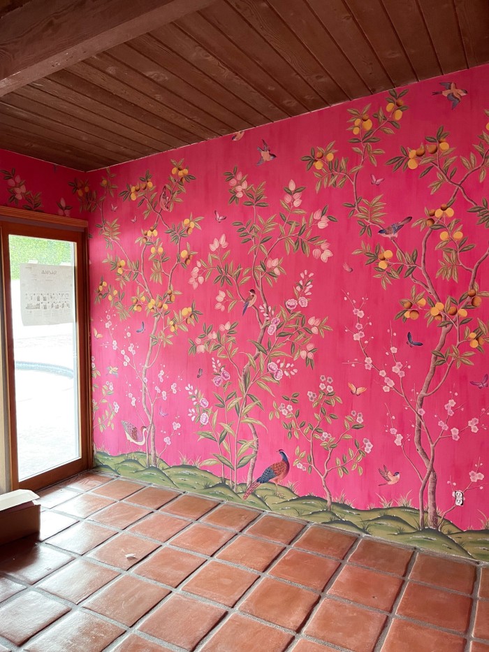 Pink chinoiserie wallpaper with wood ceilings