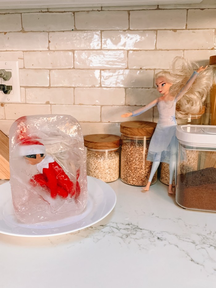 Elf on the Shelf frozen in ice with Elsa doll