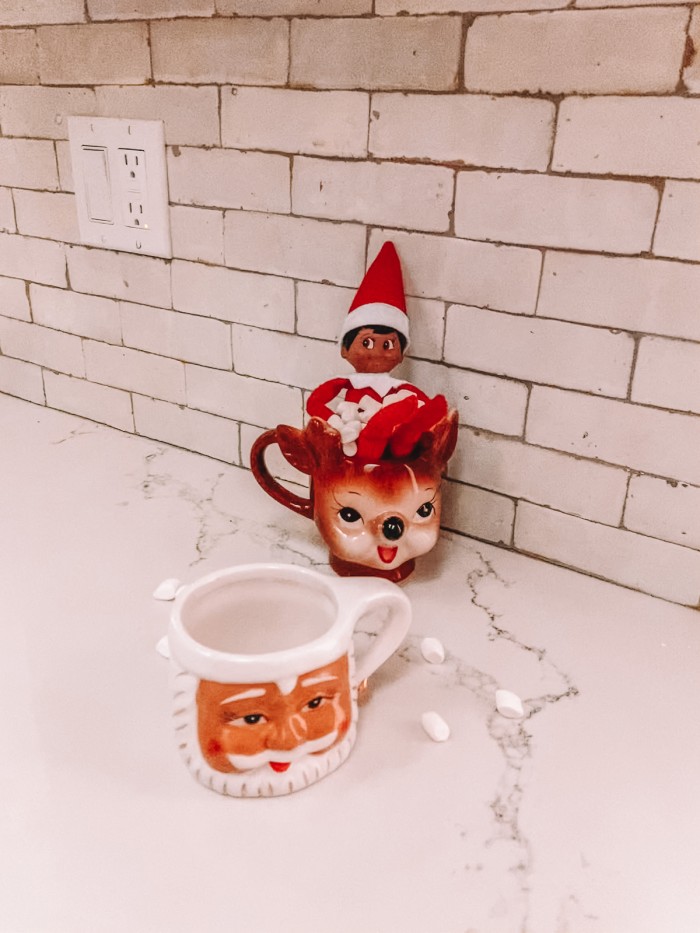 Elf on the Shelf in hot cocoa mug