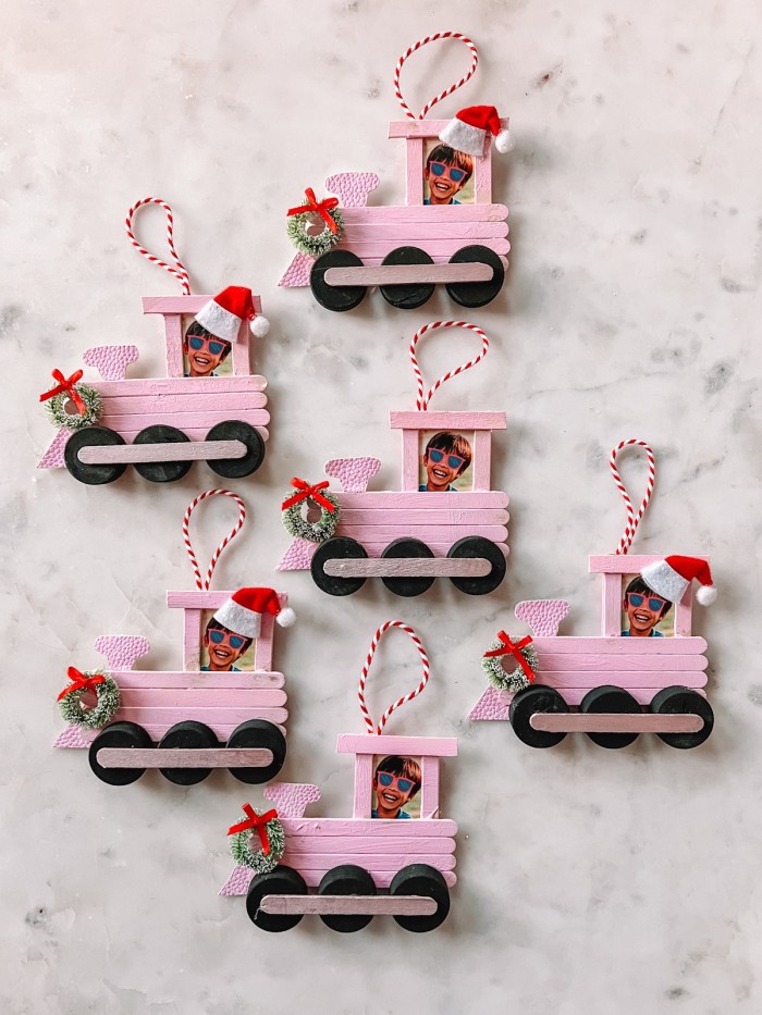 Popsicle Stick Train Christmas Ornaments on marble table