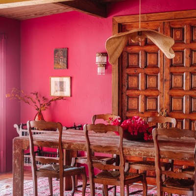 A Striking Magenta Pink Dining Room pink dining room with wood table and chairs