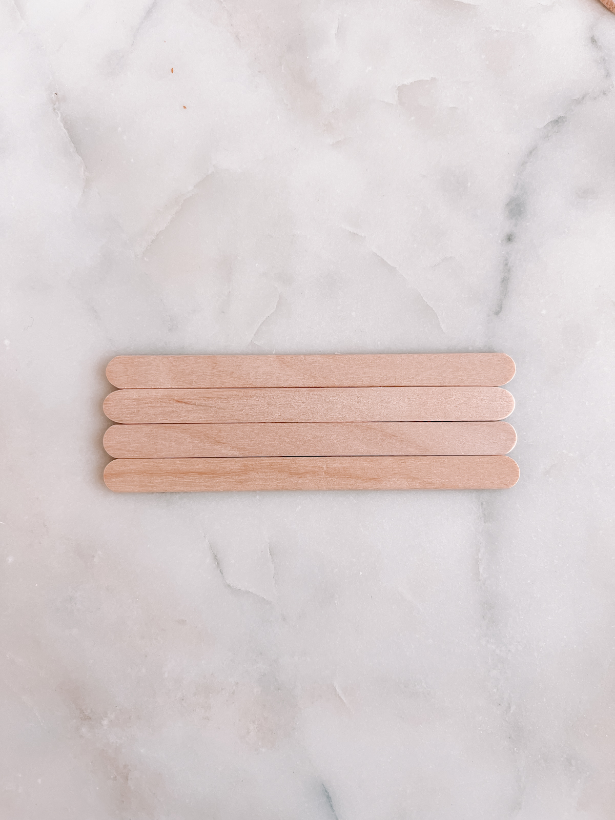 popsicle sticks on marble table