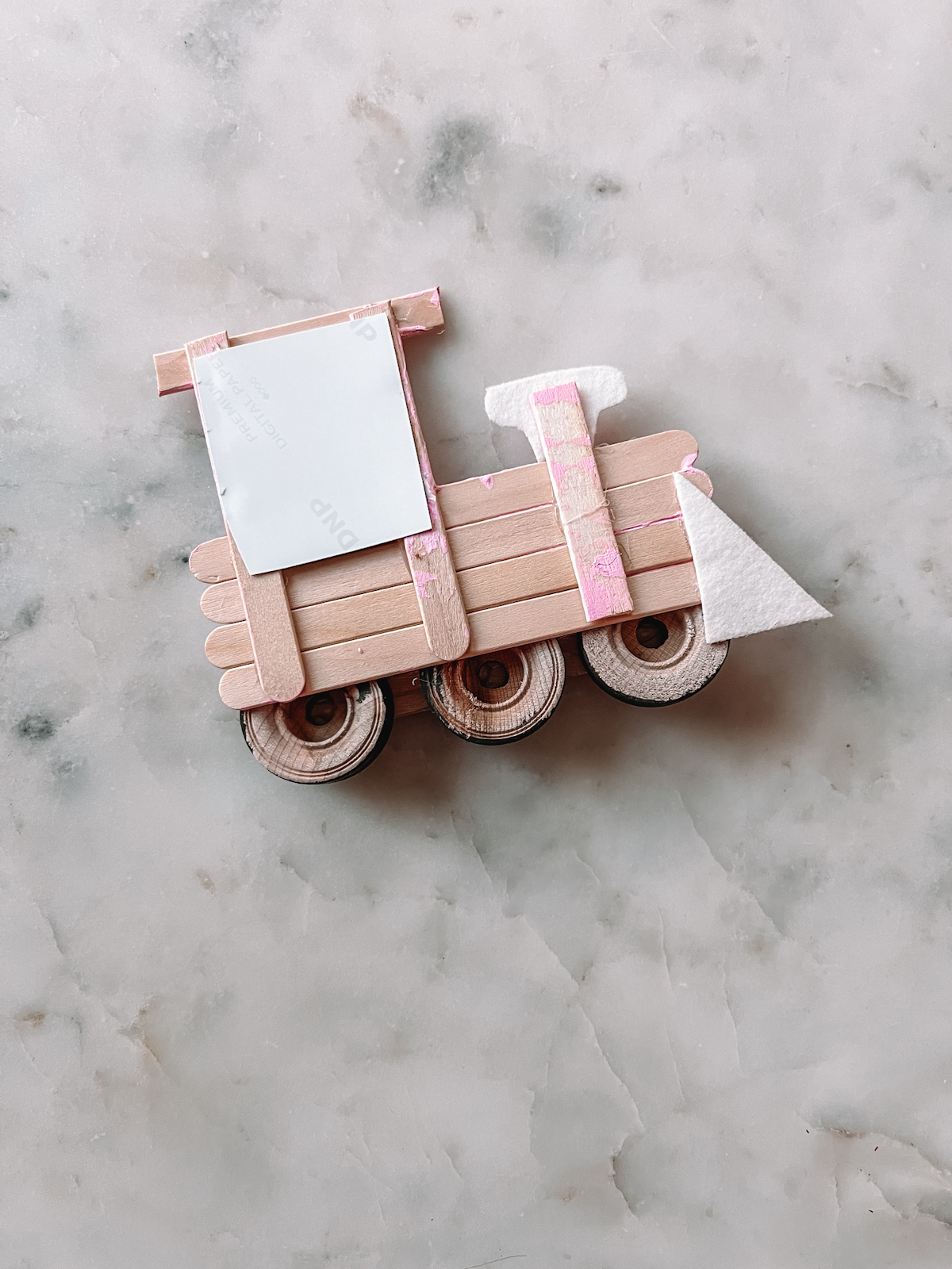 popsicle stick train upside down on table