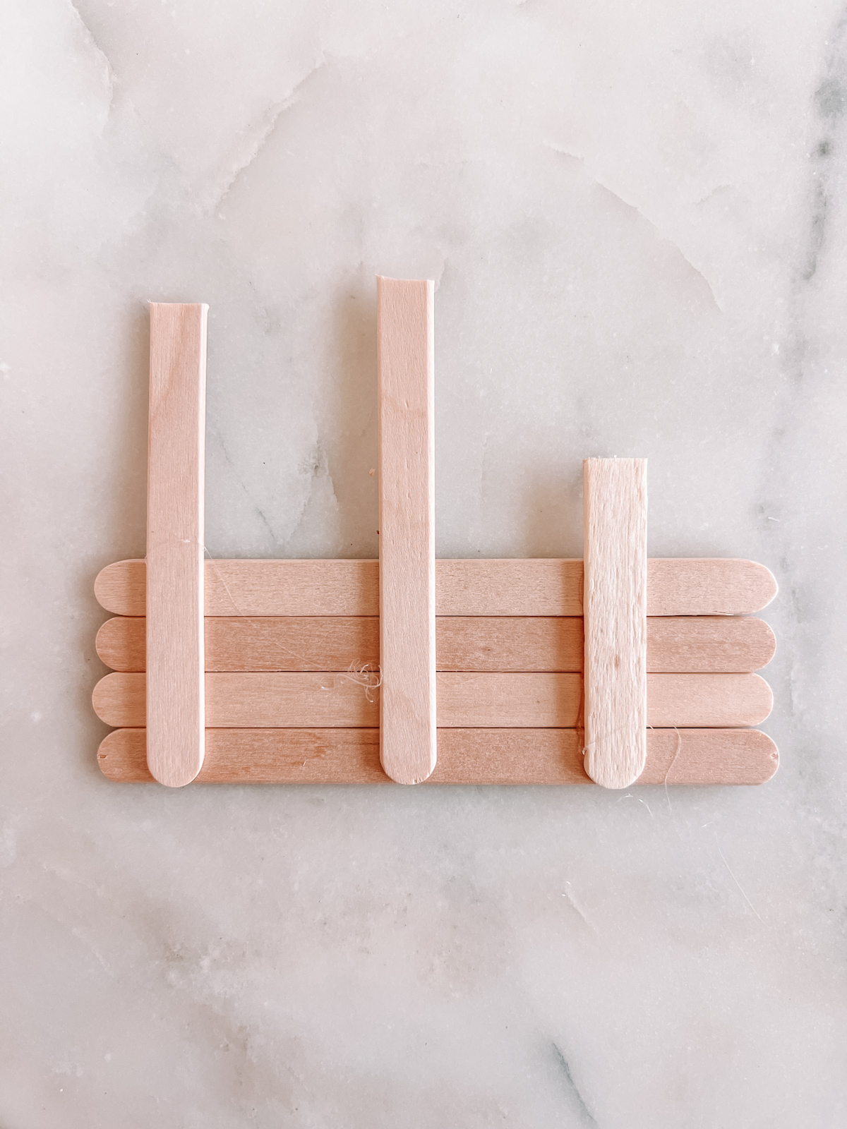 popsicle sticks on marble