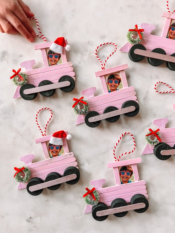 Popsicle Stick Train Christmas Ornaments on marble table