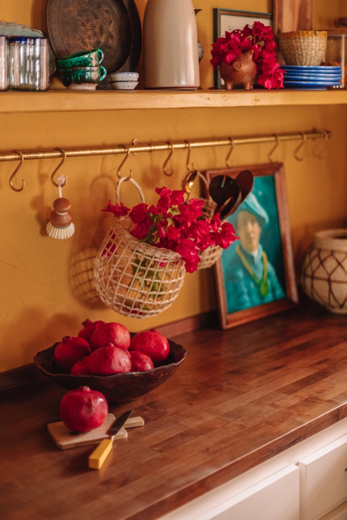 brass pot rail with basket and bougainvillea hanging