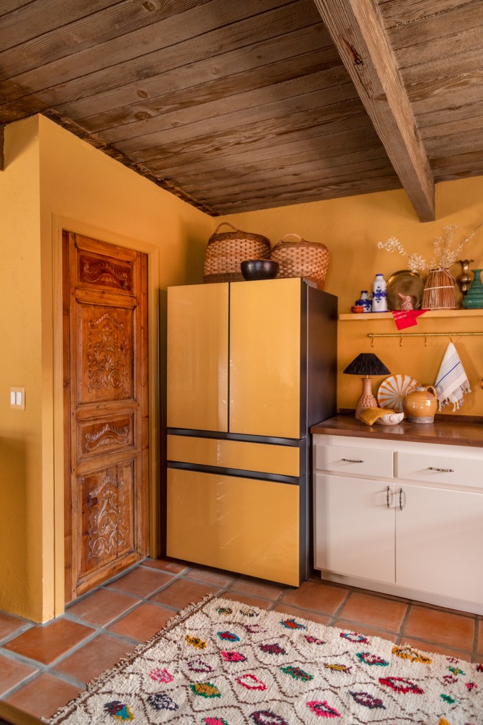Yellow Kitchen with carved wood door
