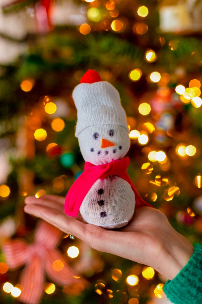 Sock Snowman in front of tree
