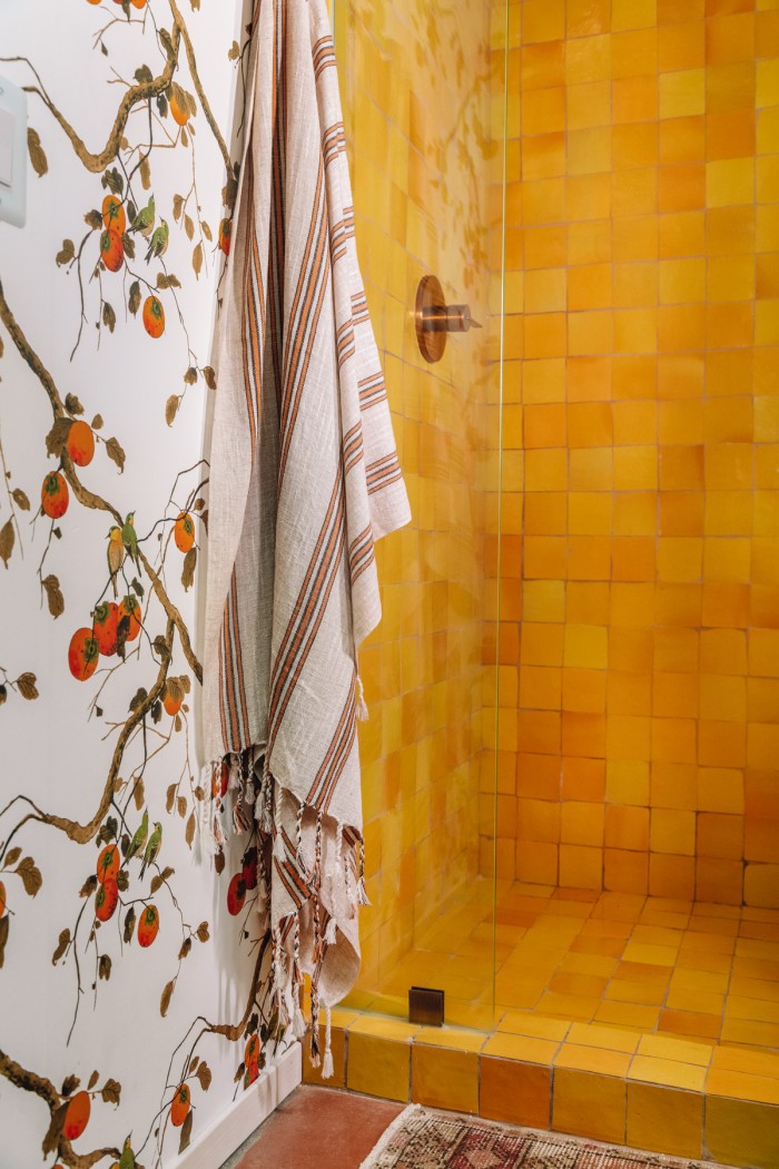 yellow shower tile with persimmon floral wallpaper