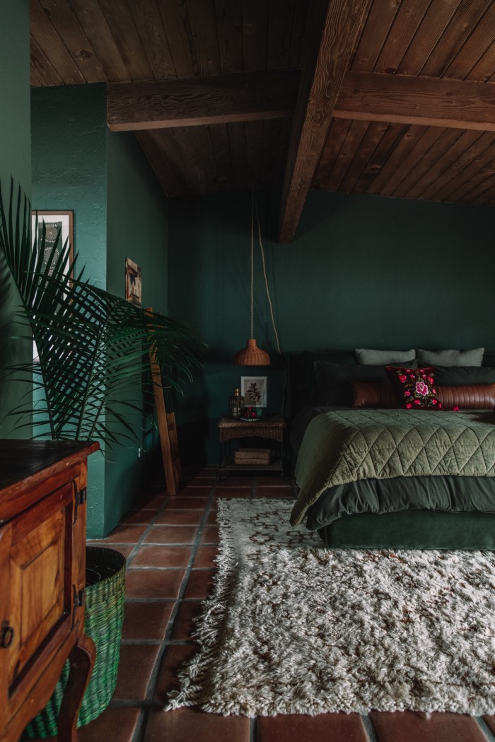 dark green bedroom with shag moroccan rug
