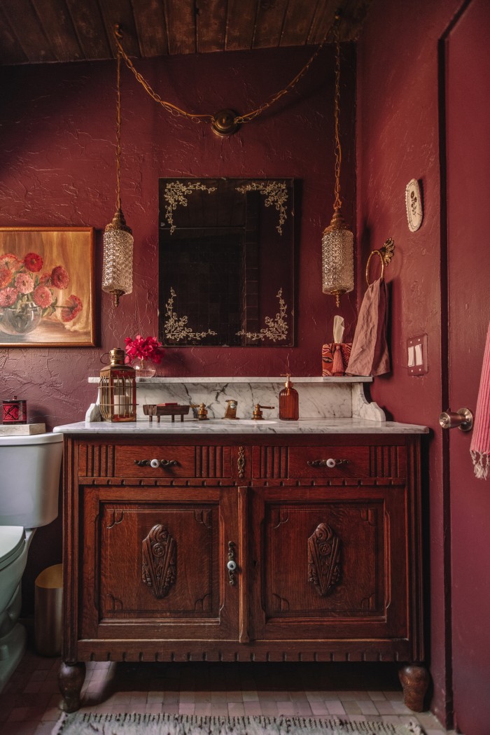 Purple Bathroom with wood antique vanity