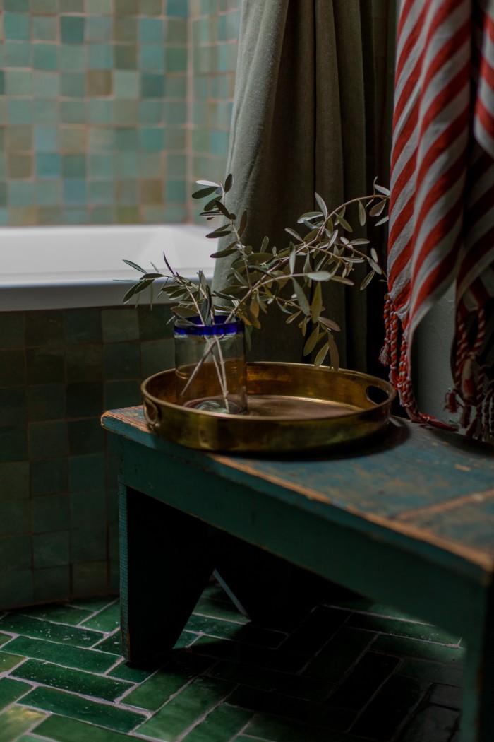 stool with brass tray and olive branches on it