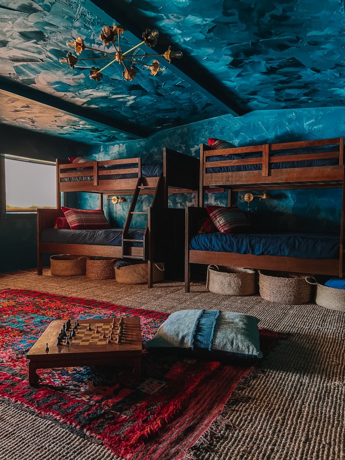 wood bunk beds in teal rooms