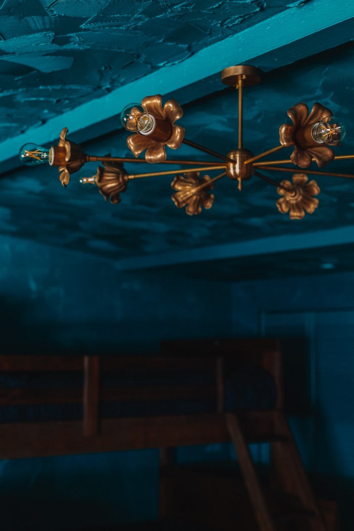 brass floral chandelier int teal room