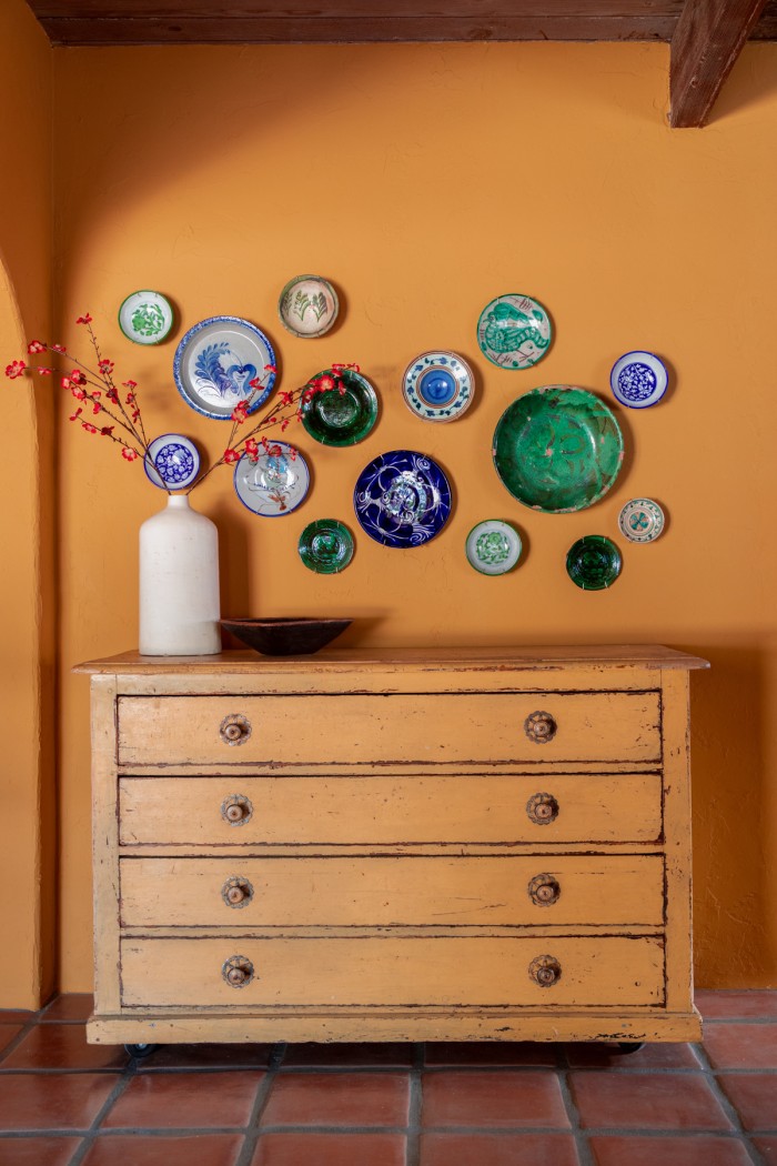 Decorative Plate Wall in yellow kitchen