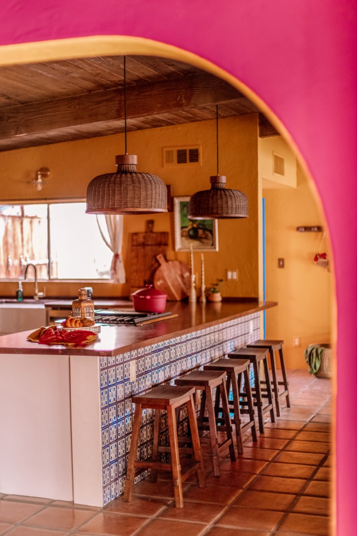 kitchen seen through pink arch
