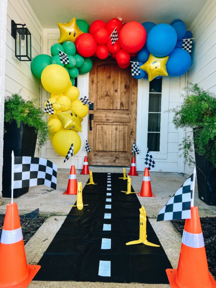 Mario balloon arc over front door.