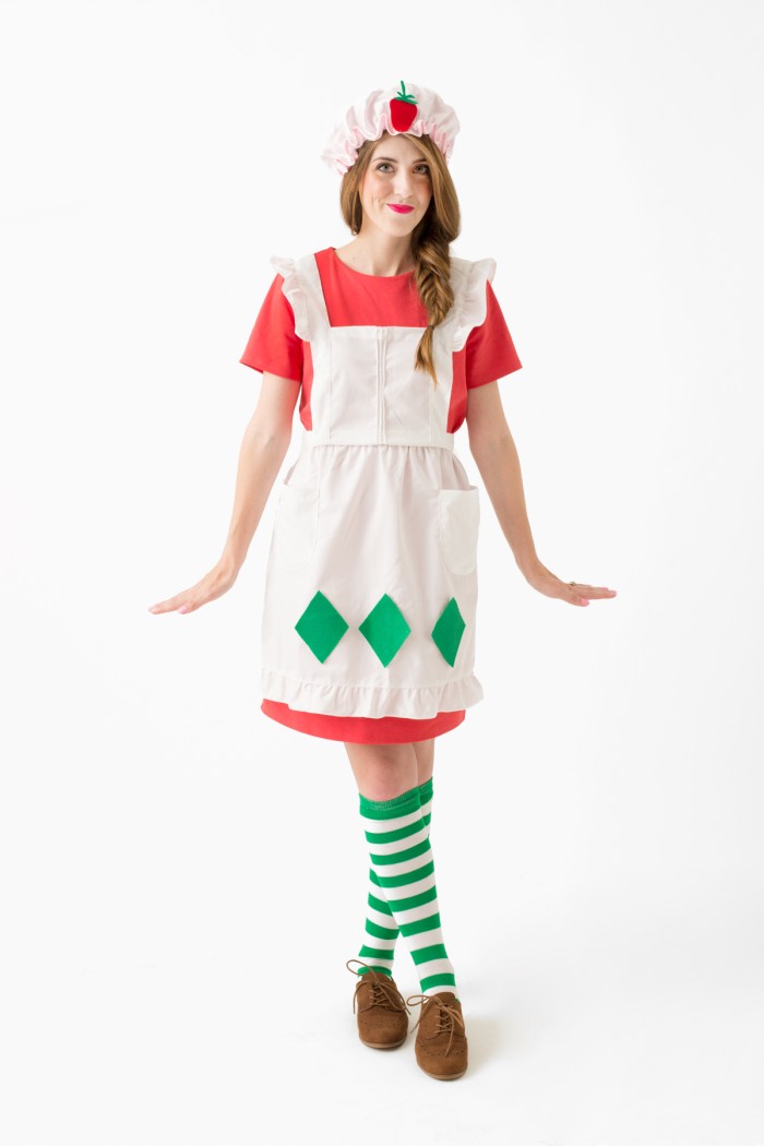 Singular strawberry shortcake with apron costume.