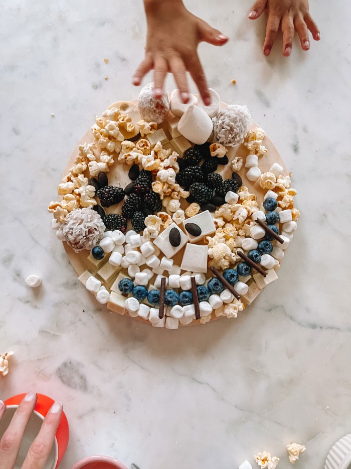 jack skellington dessert board with hand reaching in