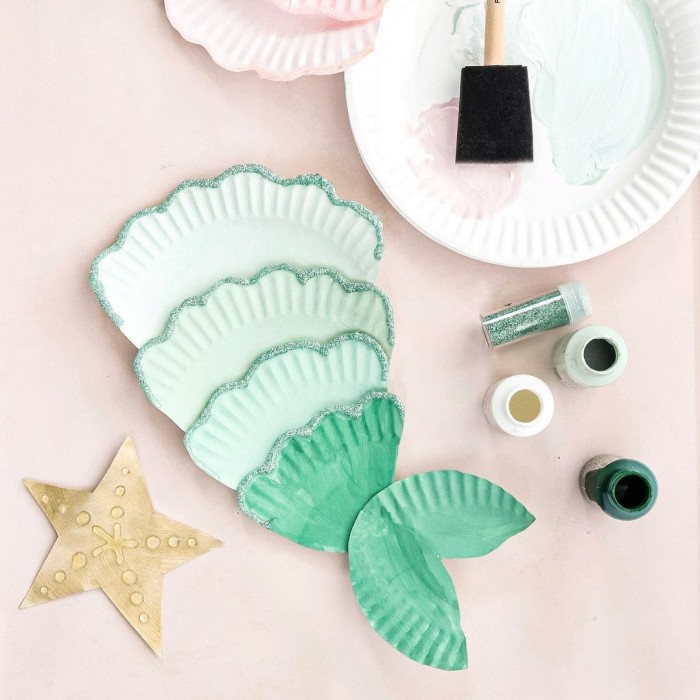 Paper plate mermaid craft on a table.