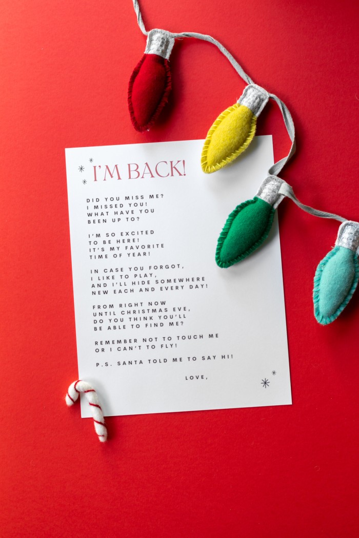 Elf on the Shelf Arrival letter on red background with felt christmas lights
