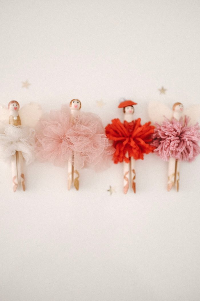 Ballerina Christmas ornaments lined up in a row. 