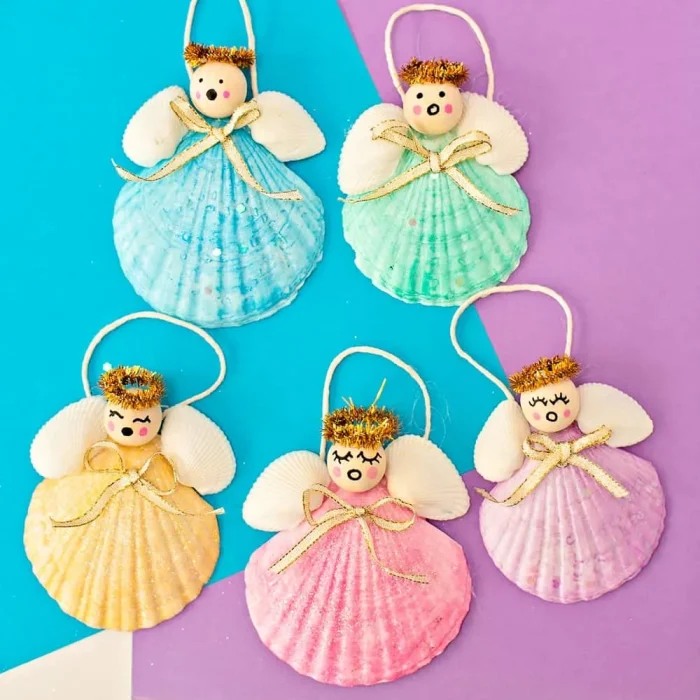 Seashell angel ornaments on a multicolor background. 