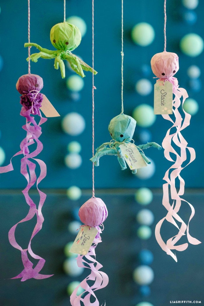 Under the sea party favors hanging by string.