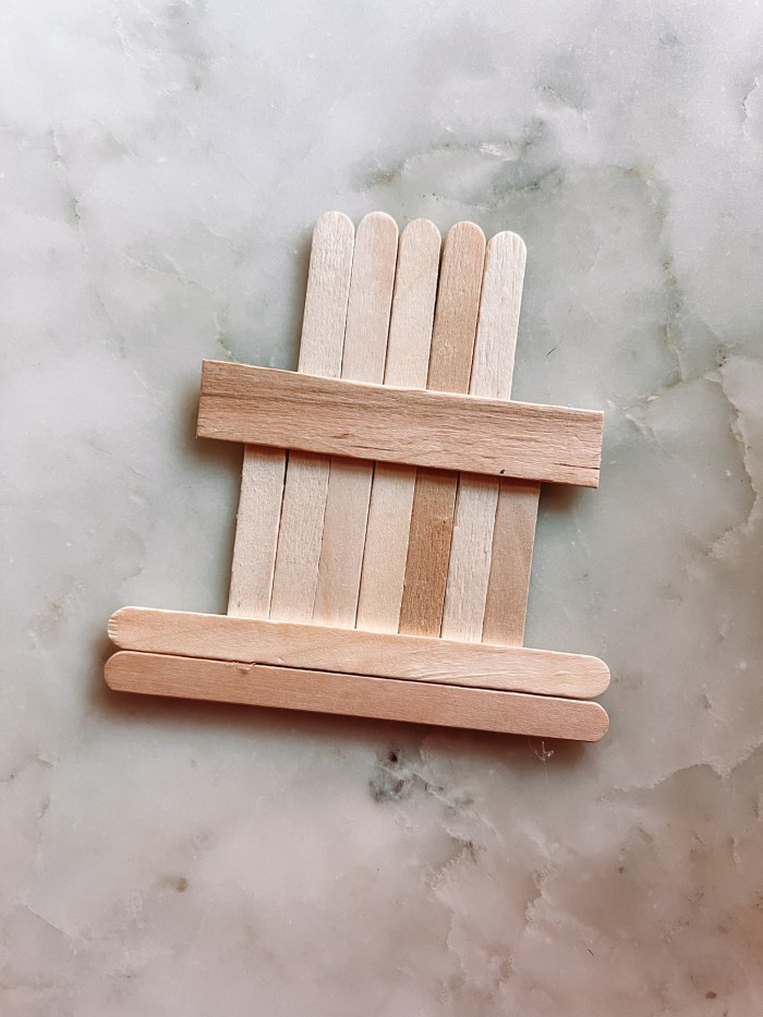 popsicle sticks laid out to look like a fireplace