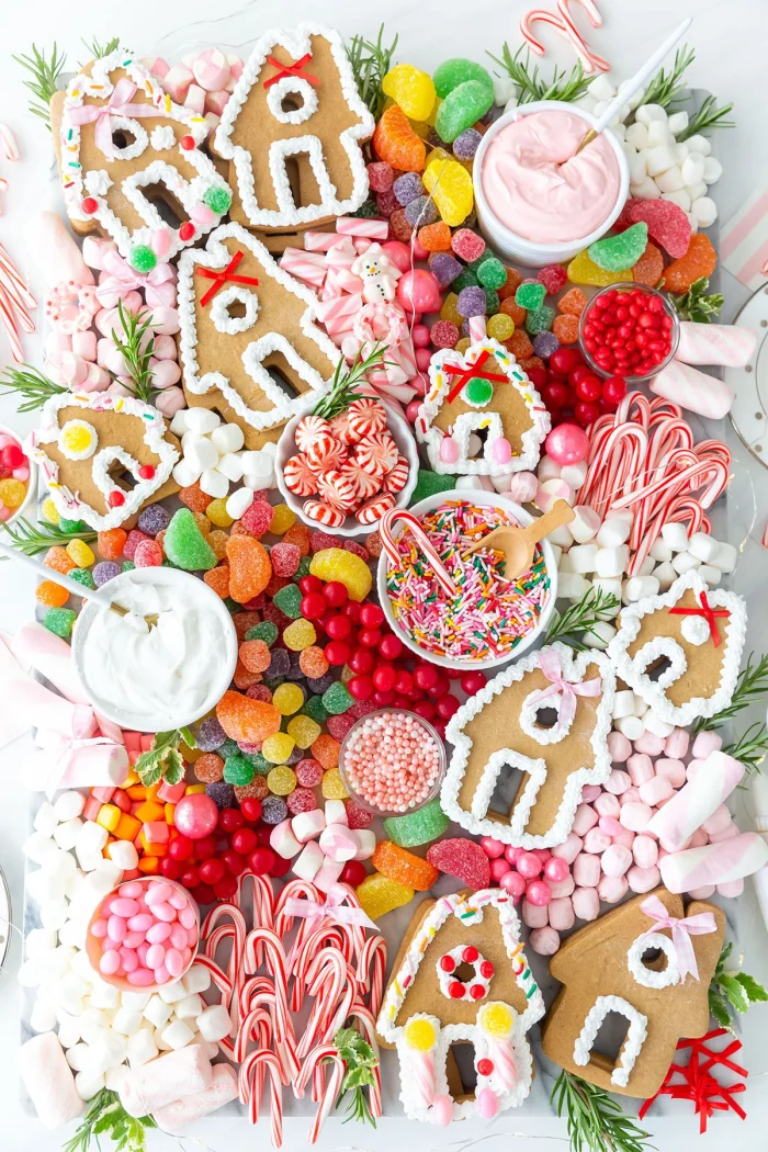 Gingerbread house toppings on a board. 