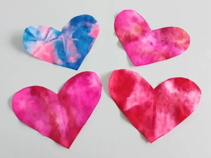 Coffee filter hearts with tie-dye designs. 