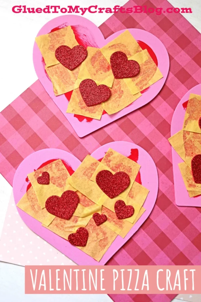 Heart shaped pizzas made out of foam paper and paint. 