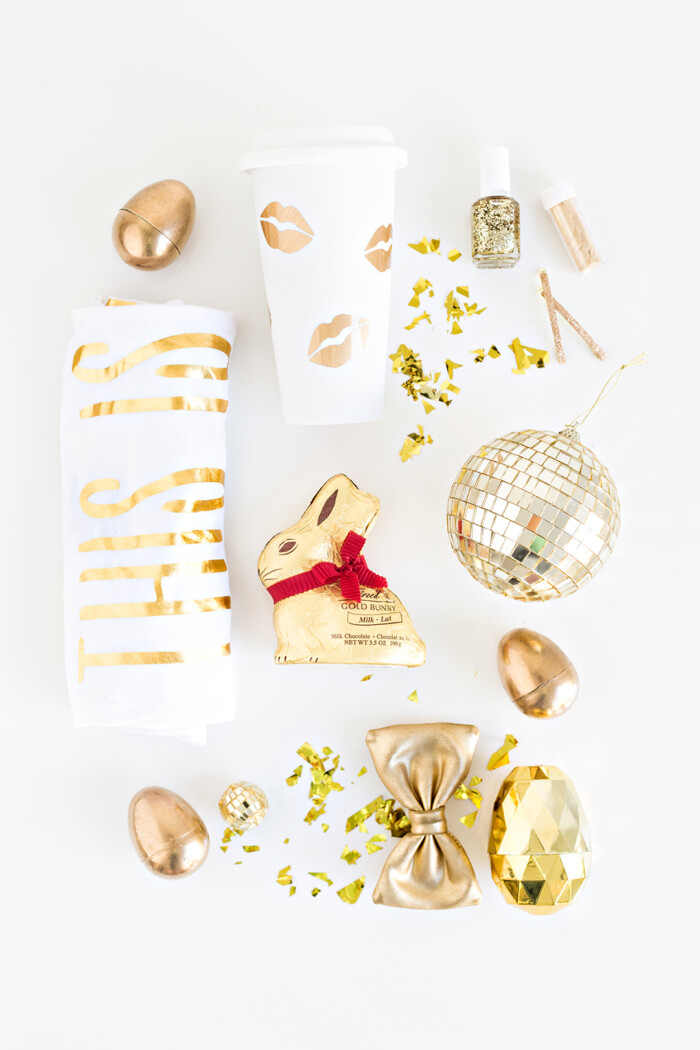 Gold-themed Easter basket fillers including a t shirt and chocolate. 