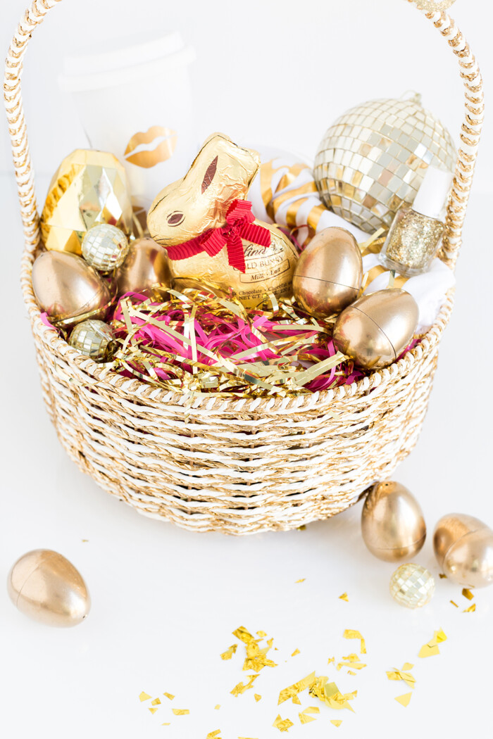 Gold Easter basked with gold-themed goodies inside. 