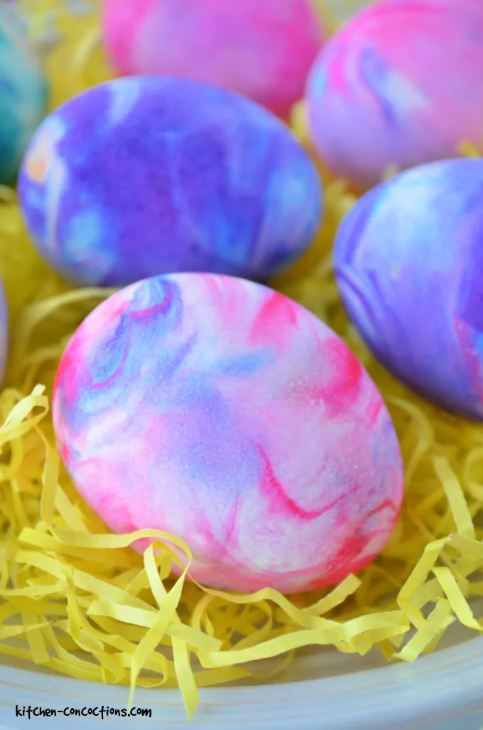 Tie dye easter eggs on yellow strips of paper. 