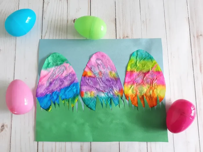 Easter eggs made from coffee filters on a wooden background. 