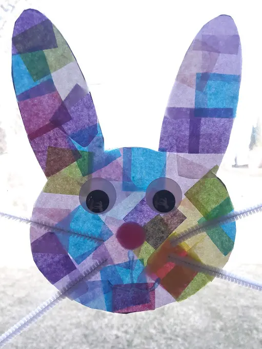 Bunny made out of tissue paper and hung on a window. 