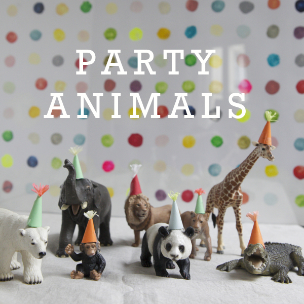 Little animal figurines with mini party hats on them and the text says "party animals"