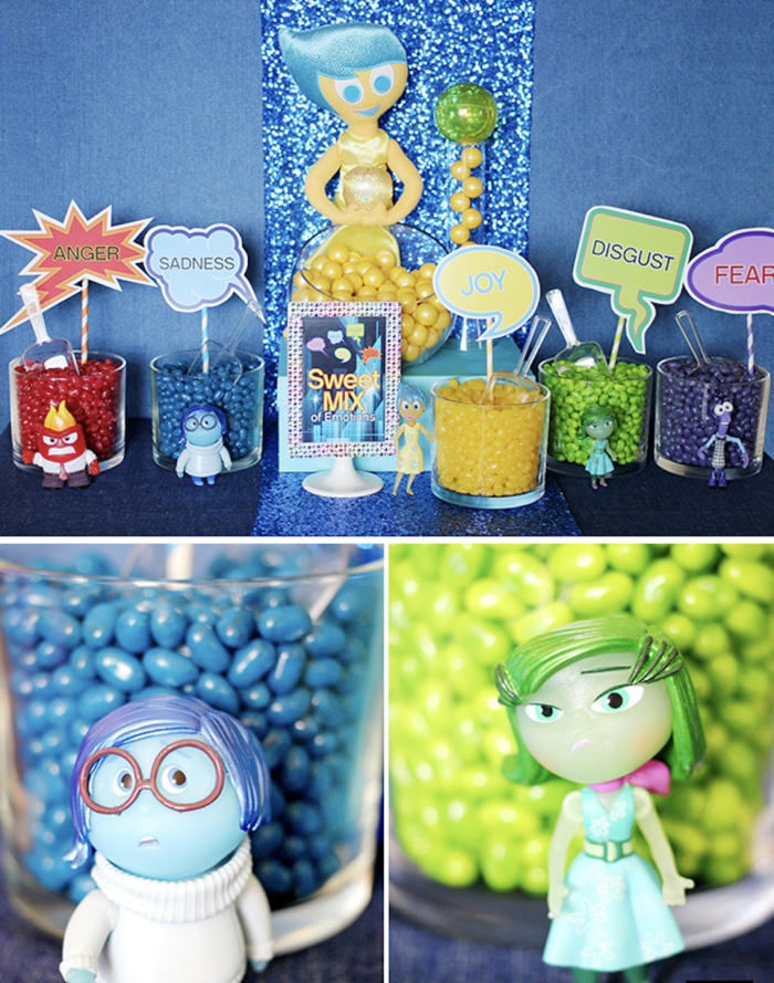 Inside out themed table with different colored jelly beans in glass containers. 