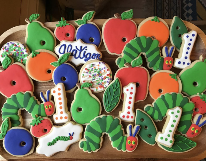 Plate of cookies with a "very hungry caterpillar" theme. 