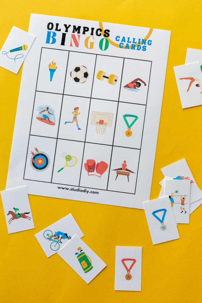 Olympics Bingo calling cards with some of the cut out. 
