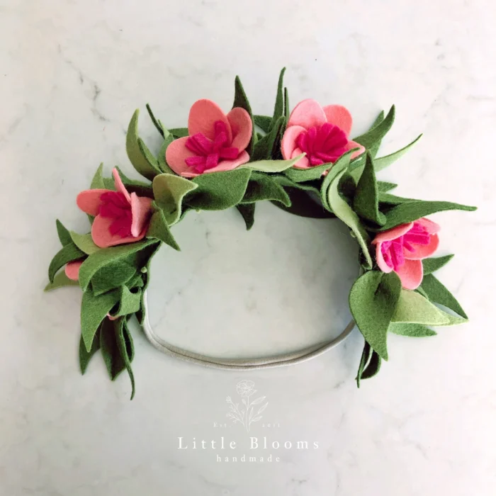 Flower crown made out of felt on a marble background. 