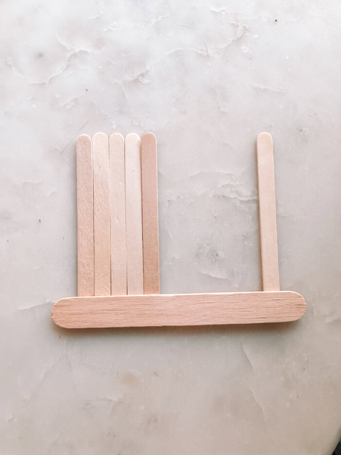 Popsicle sticks on marble